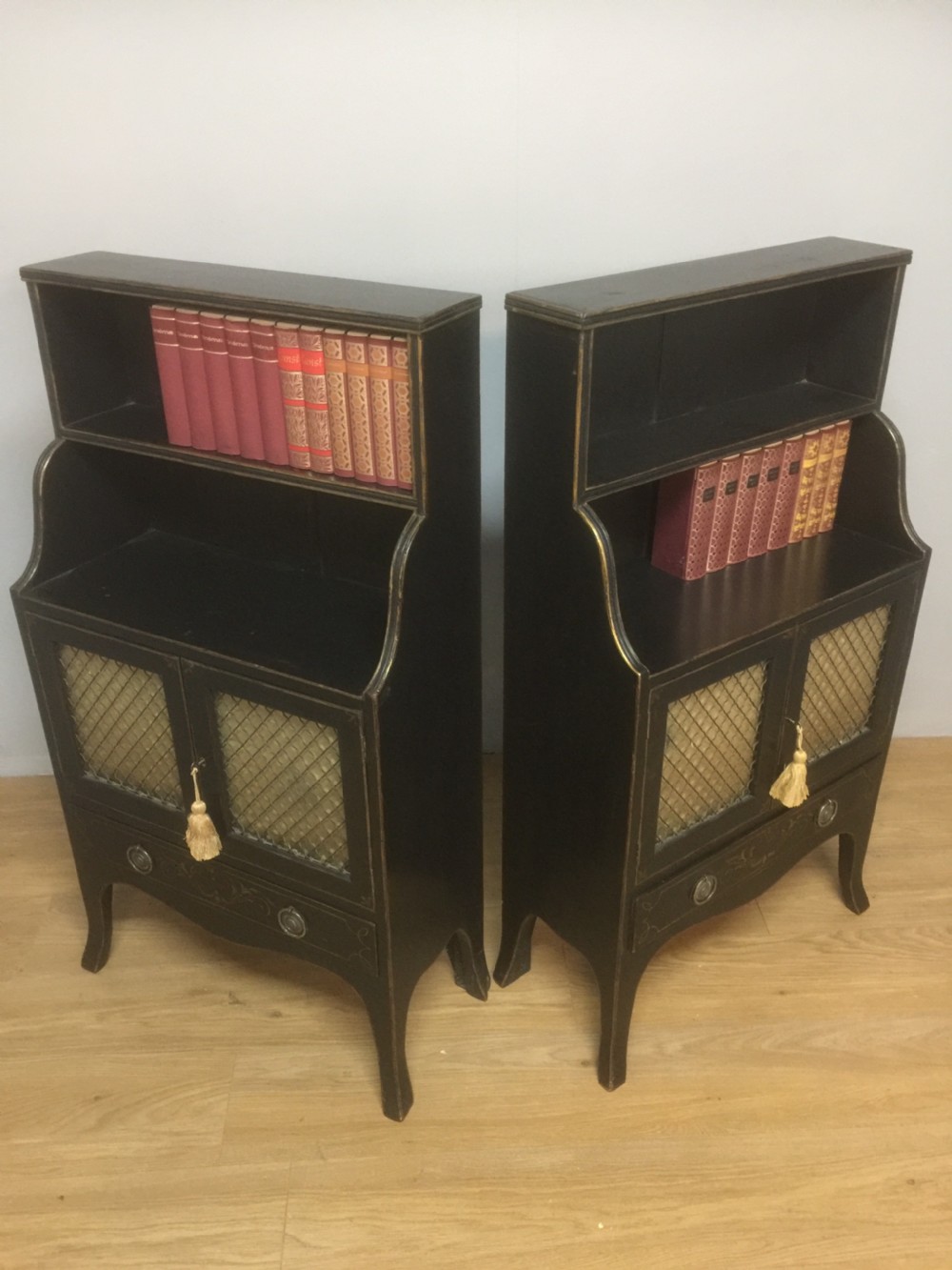 Pair of small Regency style open bookcases over cupboards circa 1910 View III