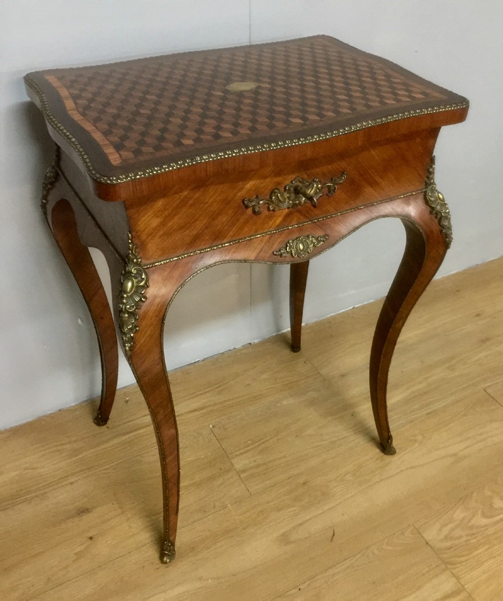 Nineteenth century French work table with parquetry top and ormolu mounts
