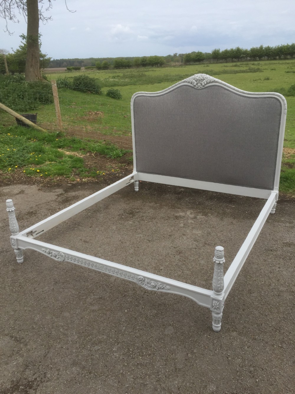 Carved wooden French bed six feet wide circa 1910 View III