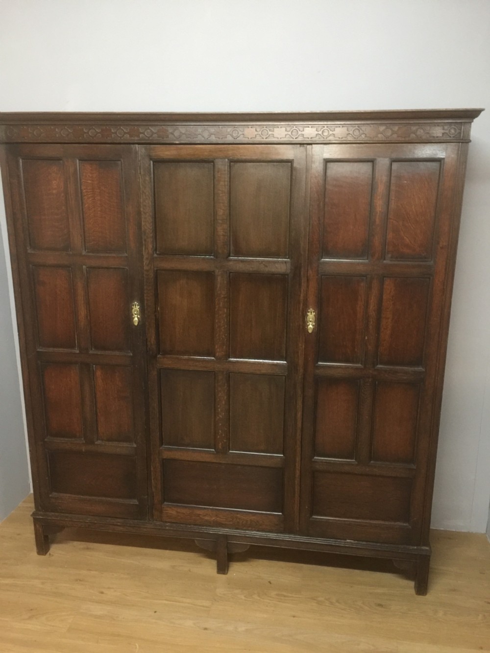 Solid oak triple wardrobe by Waring and Gillows circa 1920 