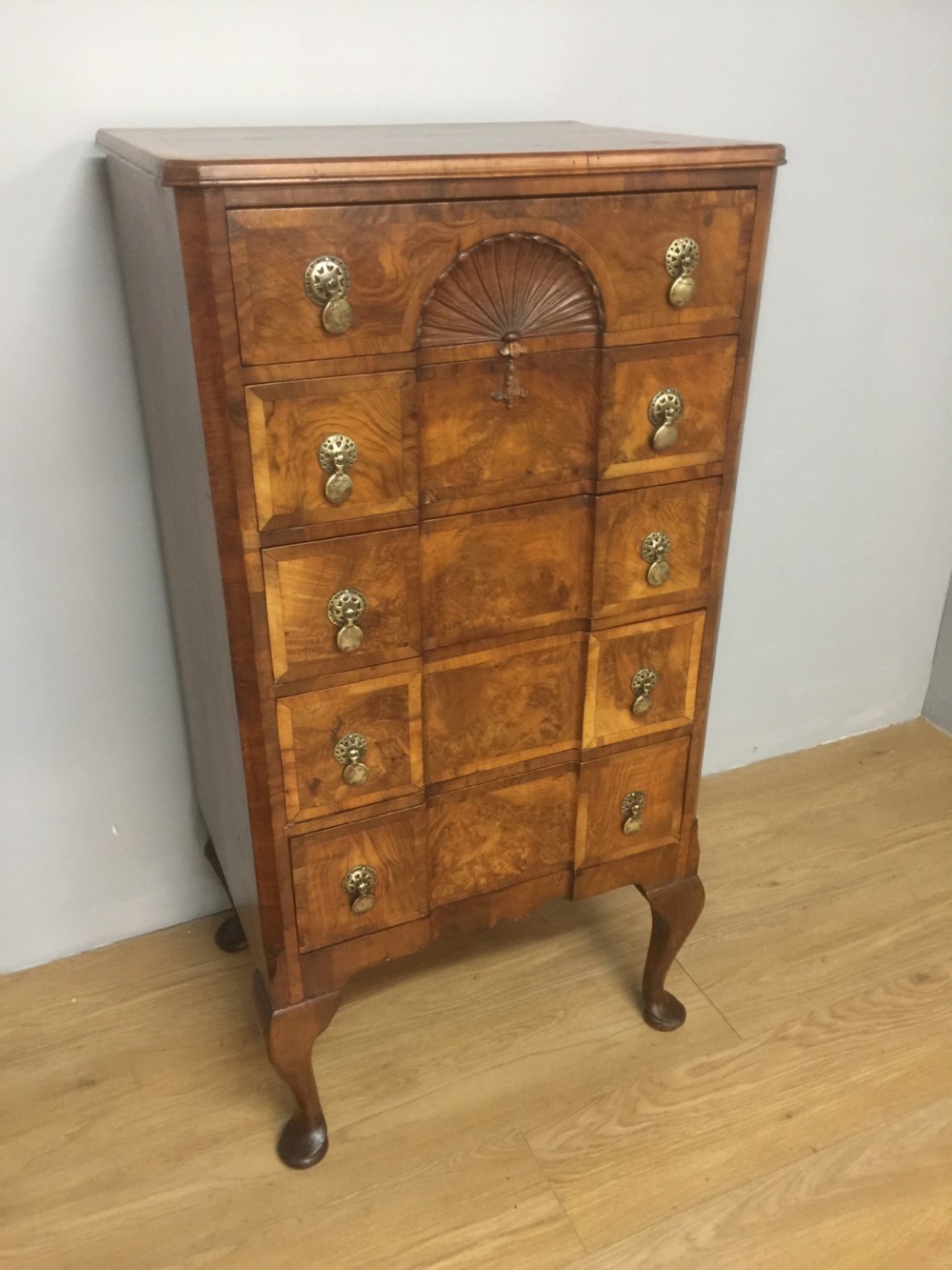 Walnut crossbanded five height chest of drawers circa 1910