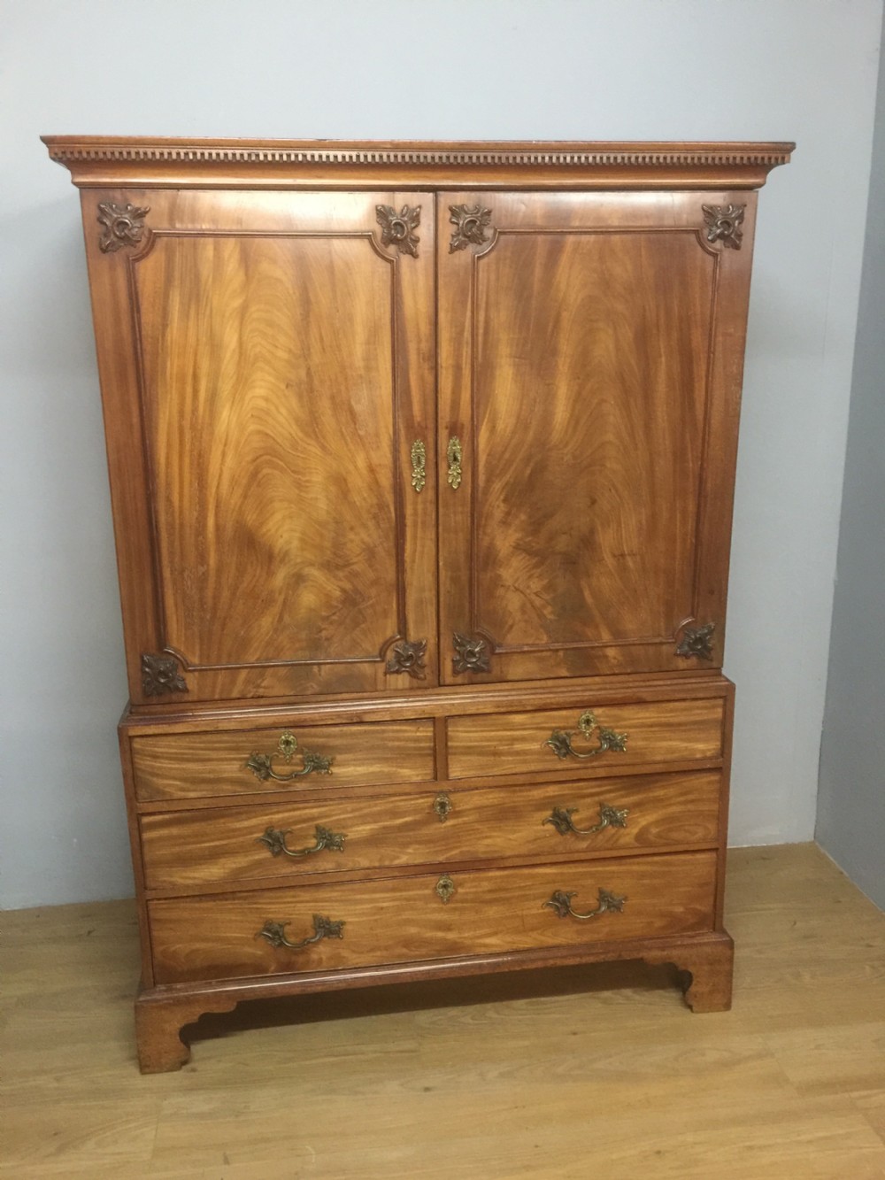 Nineteenth century flame mahogany linen press of small proportions 