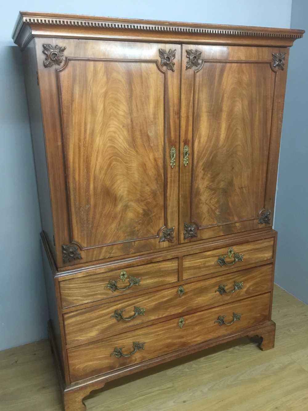 Nineteenth century flame mahogany linen press of small proportions  View II