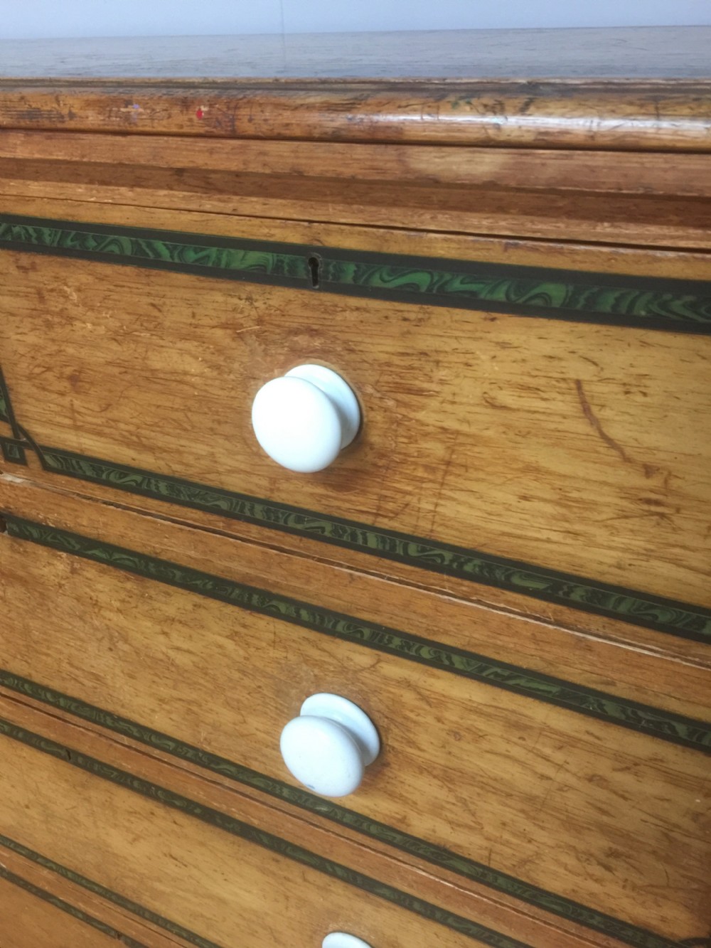 Nineteenth century pine chest of drawers with painted decoration  View III