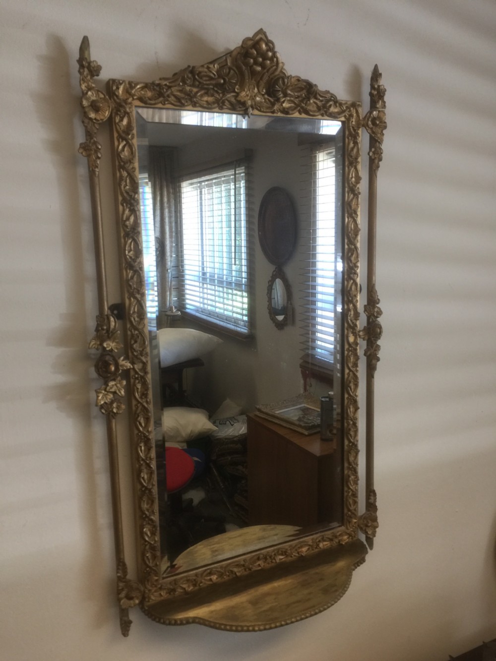 Nineteenth century bevelled mirror in an ornate gilt frame View II