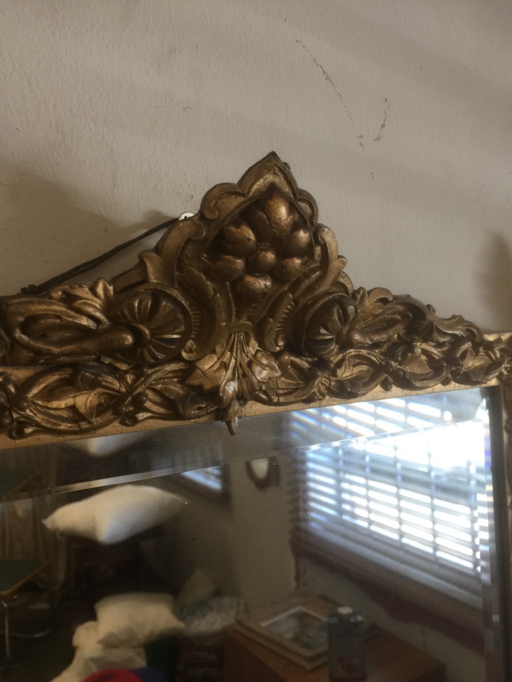 Nineteenth century bevelled mirror in an ornate gilt frame View III