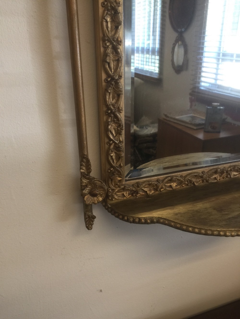 Nineteenth century bevelled mirror in an ornate gilt frame View IV