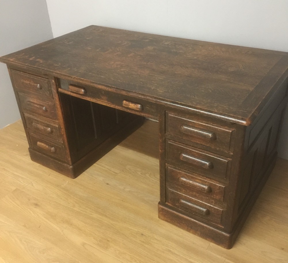 Large oak twin pedestal desk with fielded panels circa 1910