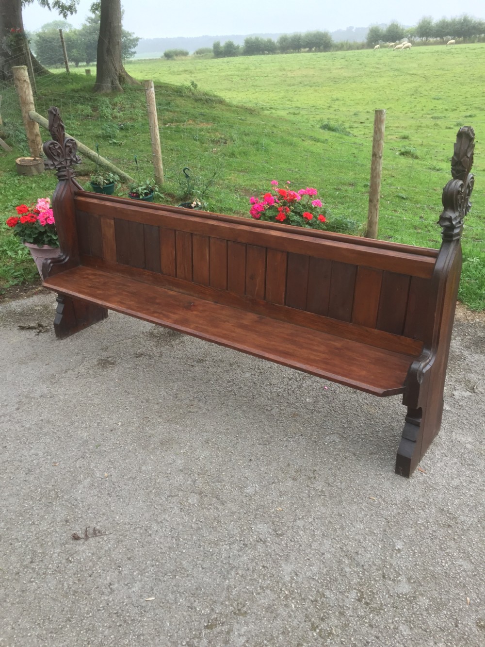 Nineteenth century pine pew with carved fleur de Lys finials   View II
