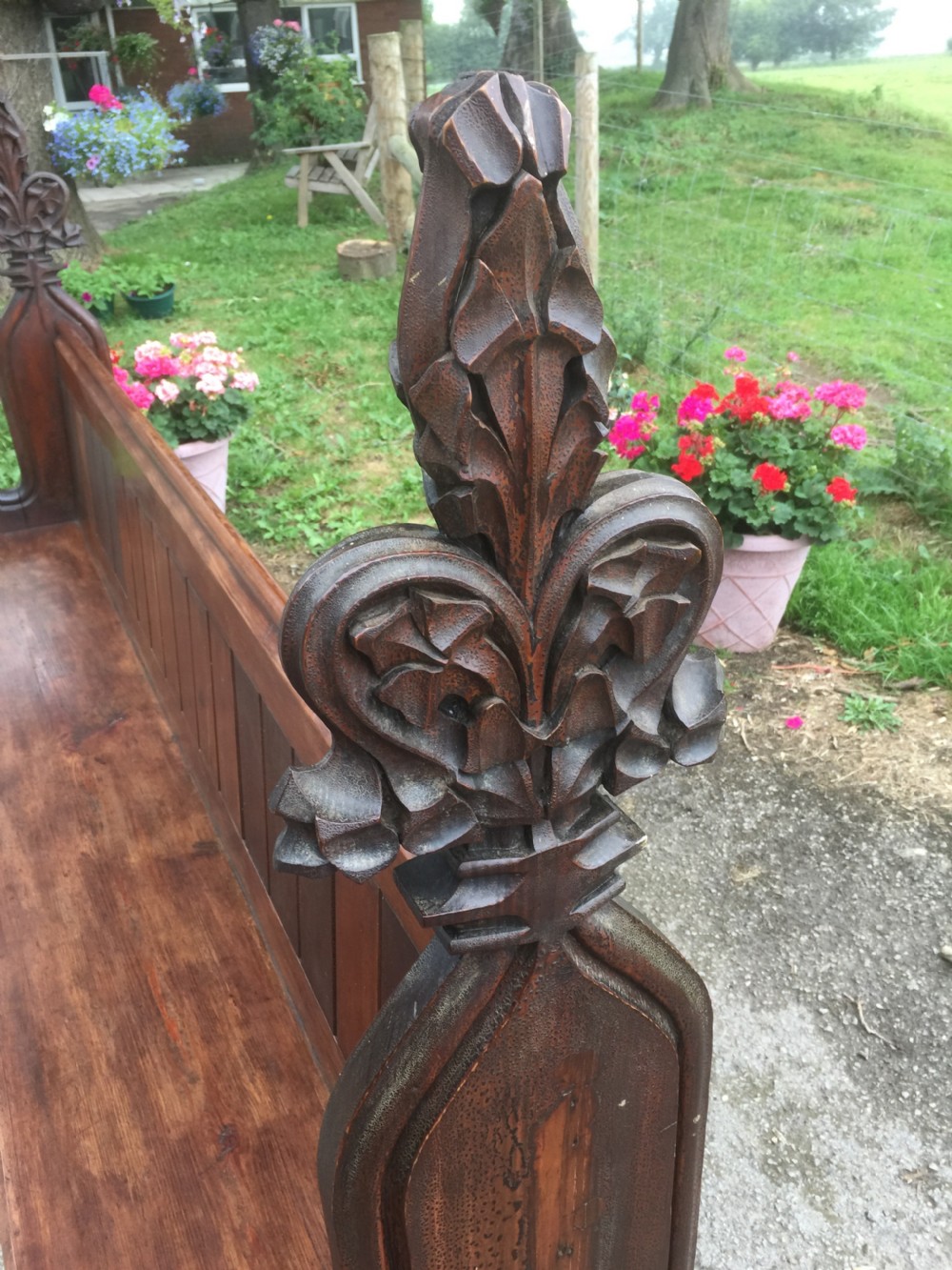 Nineteenth century pine pew with carved fleur de Lys finials   View V