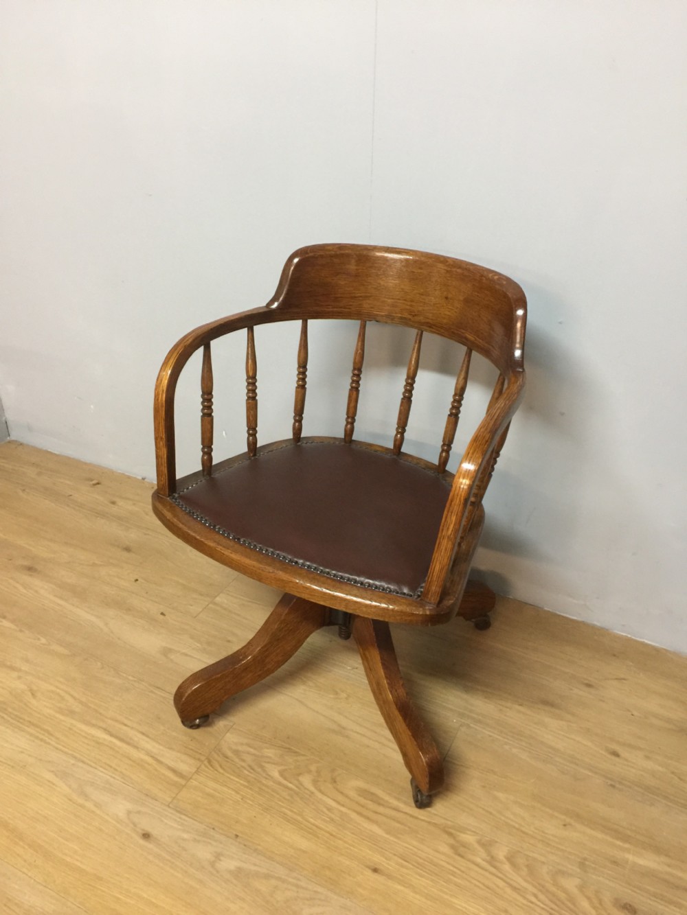 Solid oak revolving desk chair