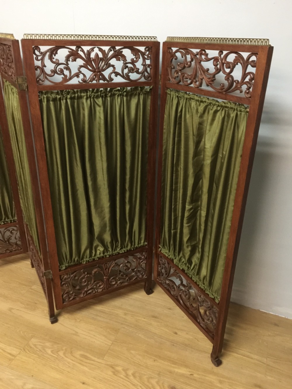 Late nineteenth century four panel screen with scrolling panels and brass gallery  View II
