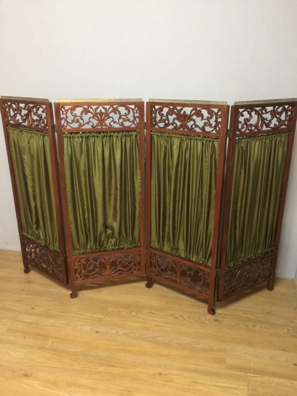 Late nineteenth century four panel screen with scrolling panels and brass gallery  View VIII