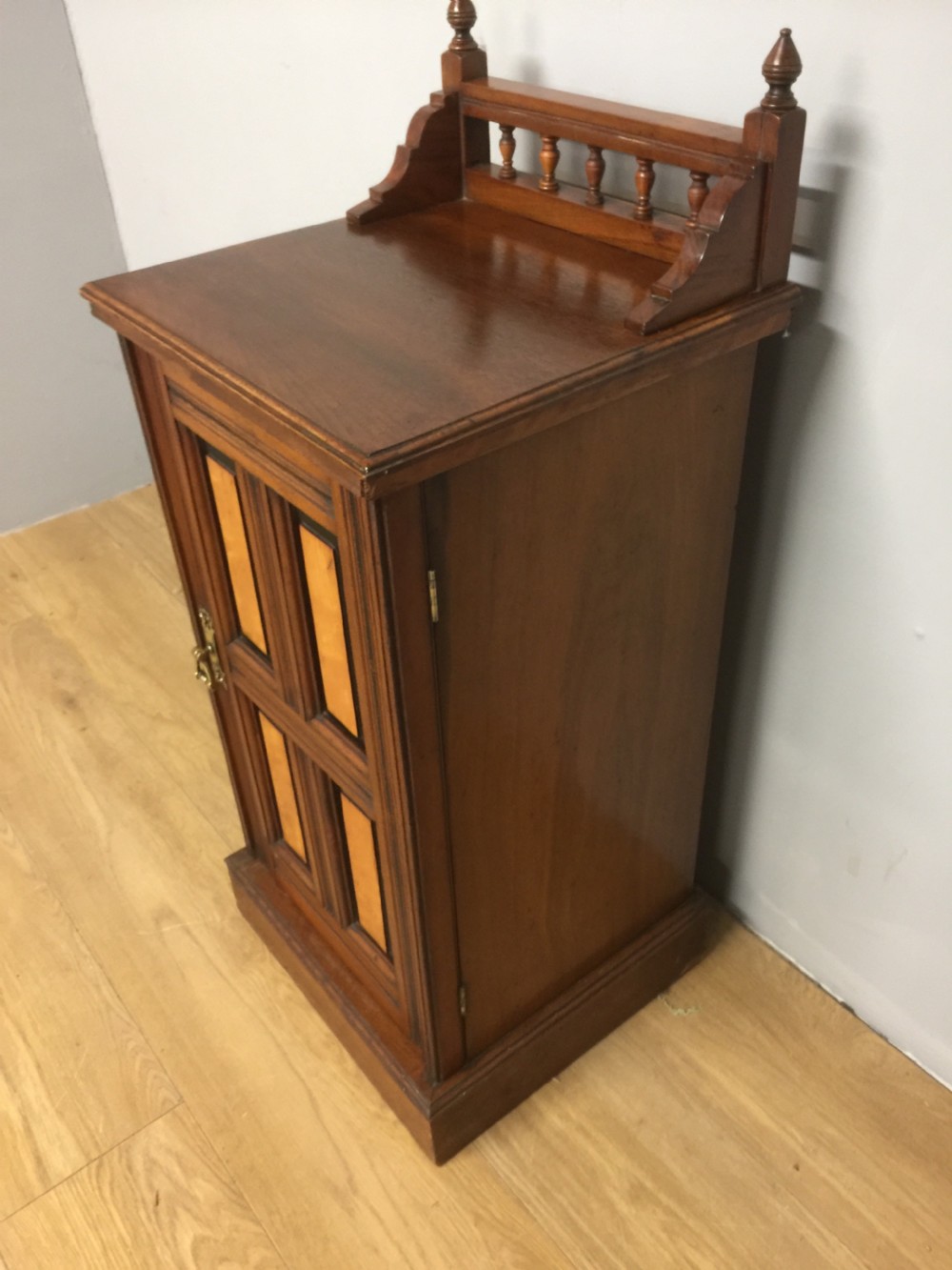 Walnut bedside cabinet with ebony and satin birch panels circa 1890 View V