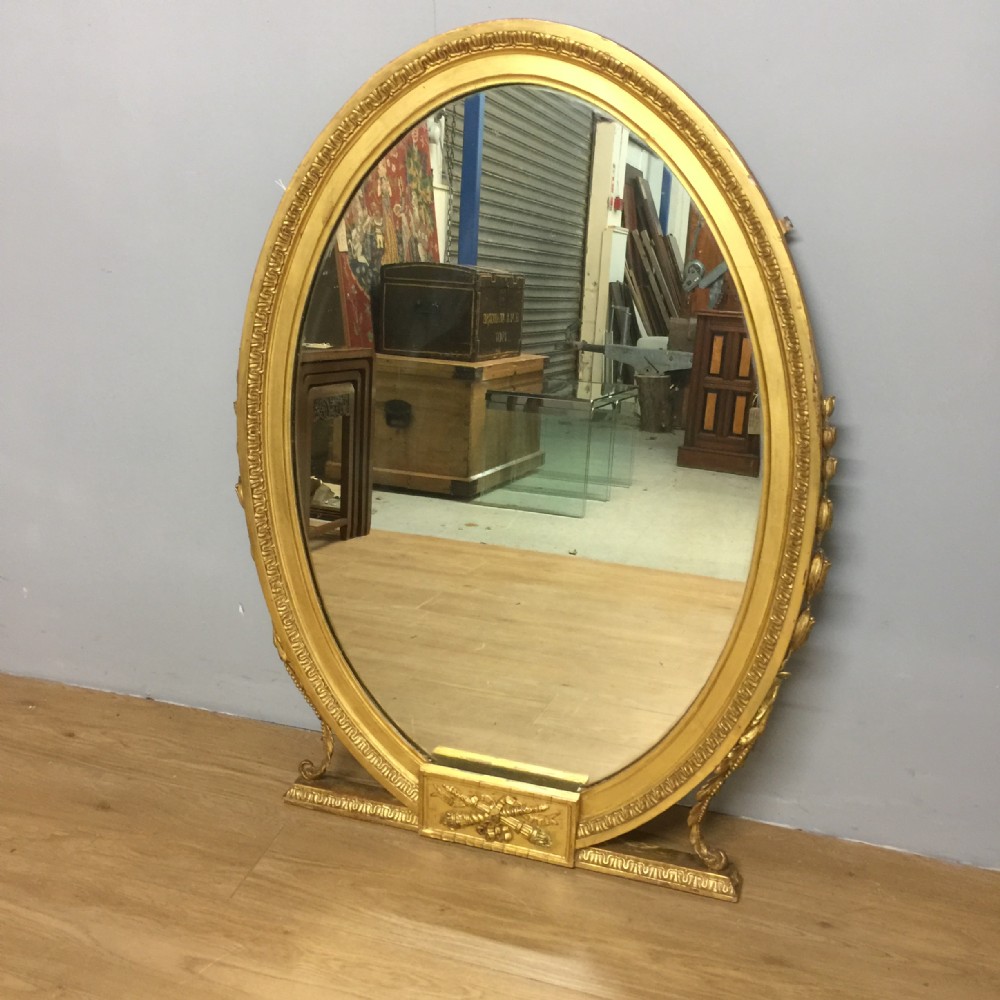 Nineteenth century giltwood and gesso oval pier glass