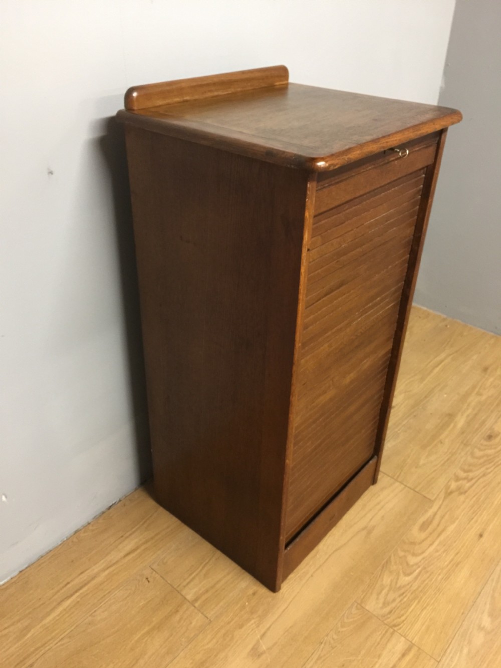 Oak tambour fronted filing cabinet in original condition  View V