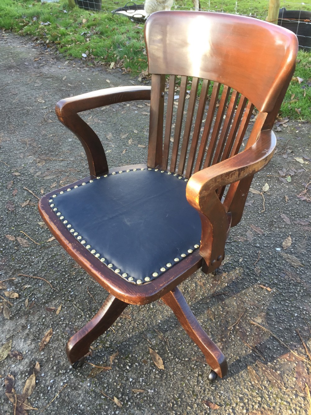 Slat back swivel office chair with leather seat  circa 1920 View III