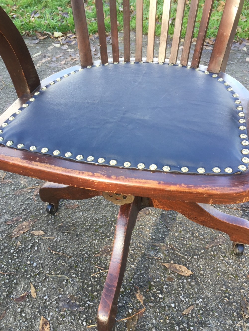 Slat back swivel office chair with leather seat  circa 1920 View VI