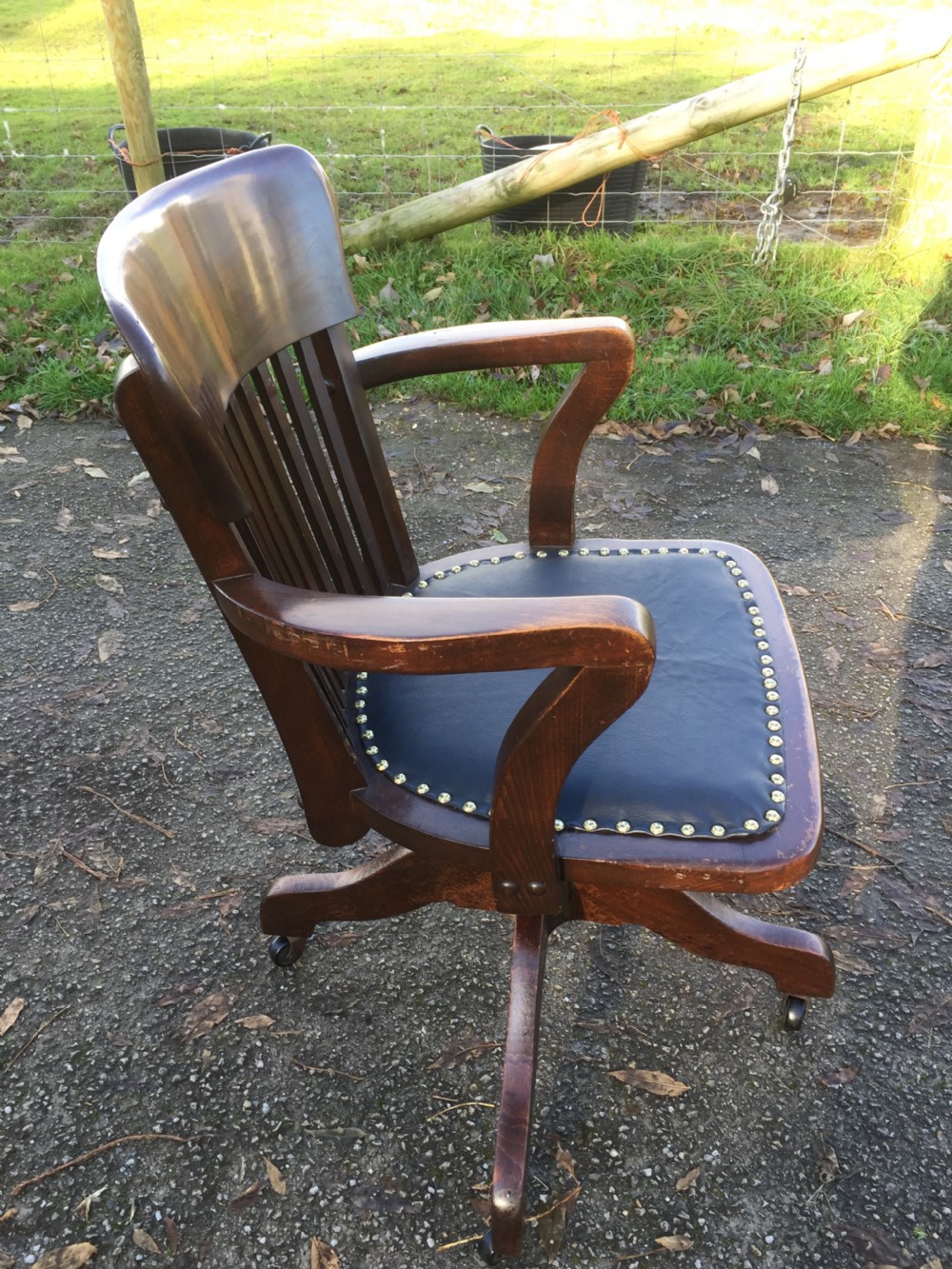 Slat back swivel office chair with leather seat  circa 1920 View VII