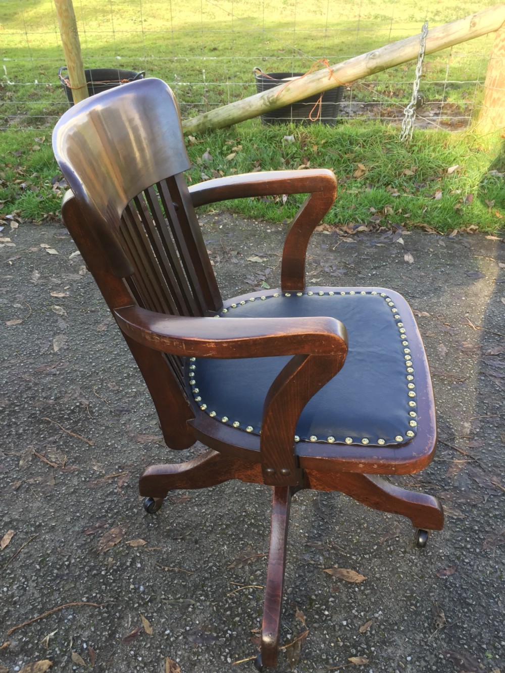 Slat back swivel office chair with leather seat  circa 1920 View VIII