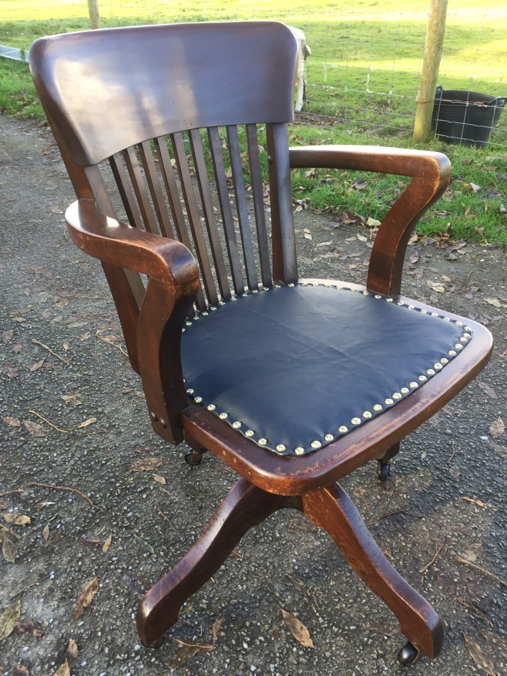 Slat back swivel office chair with leather seat  circa 1920 View IX