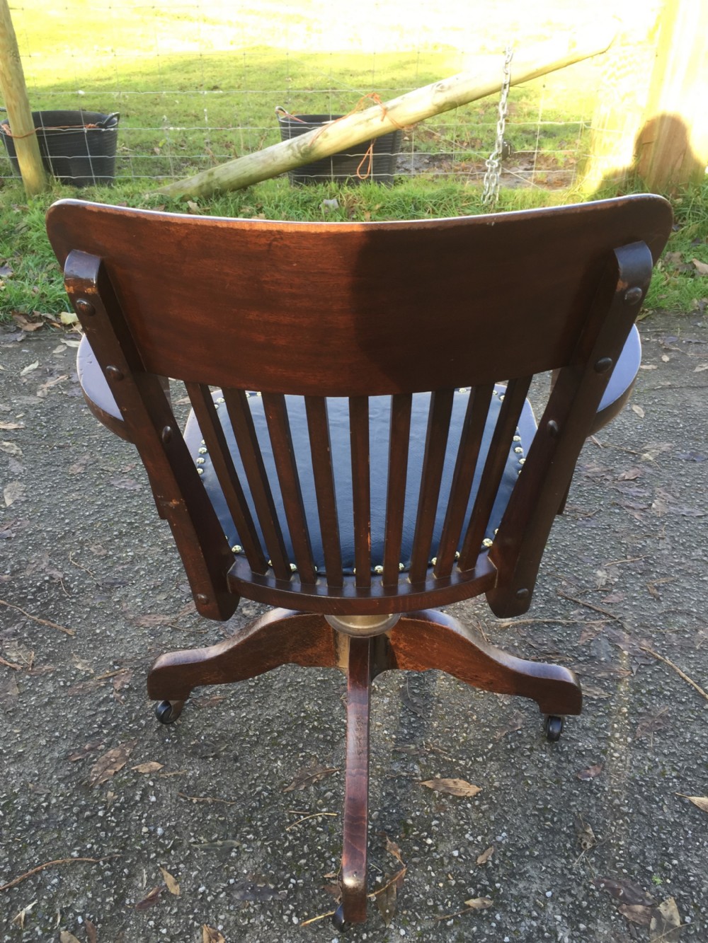 Slat back swivel office chair with leather seat  circa 1920 View XI