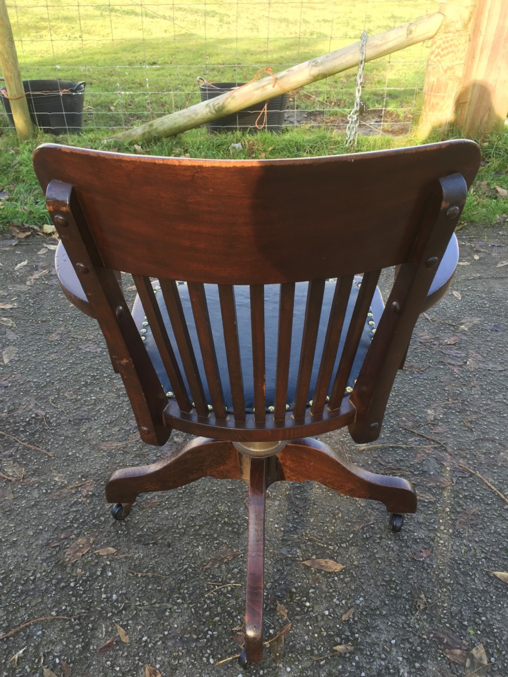 Slat back swivel office chair with leather seat  circa 1920 View XII