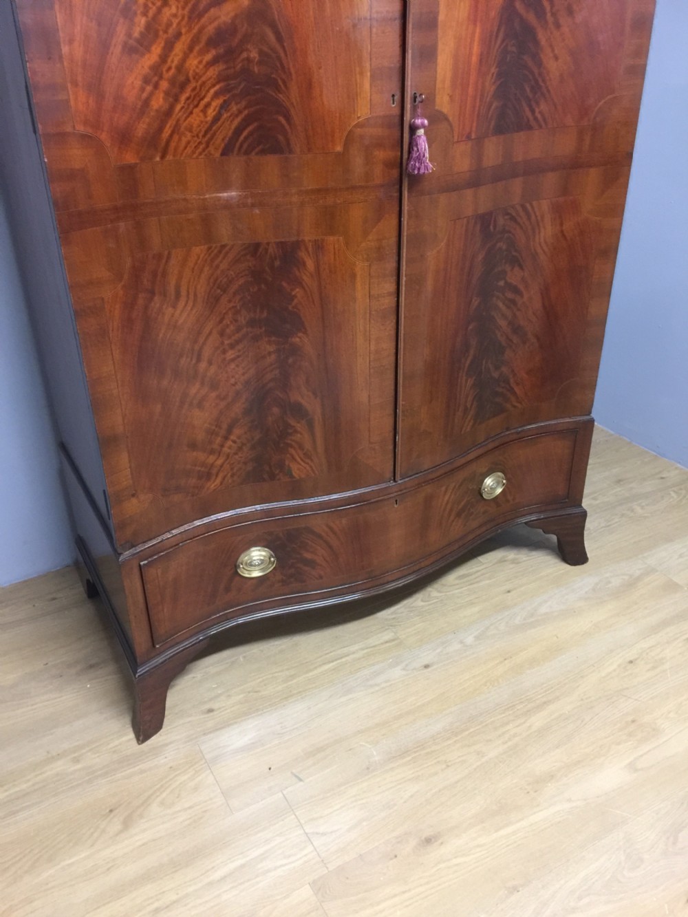 Edwardian Sheraton style serpentine fronted flame mahogany wardrobe  View IV