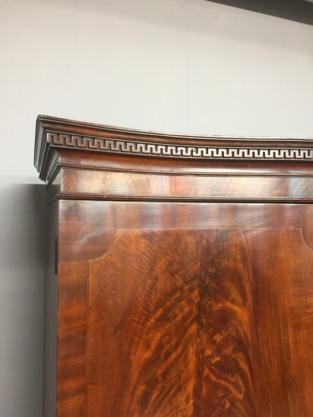 Edwardian Sheraton style serpentine fronted flame mahogany wardrobe  View V
