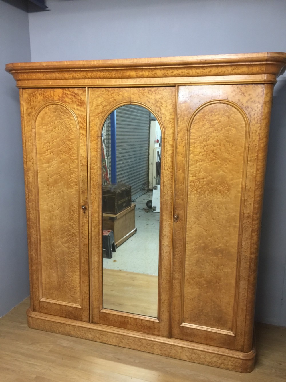 Nineteenth century birds eye maple triple wardrobe