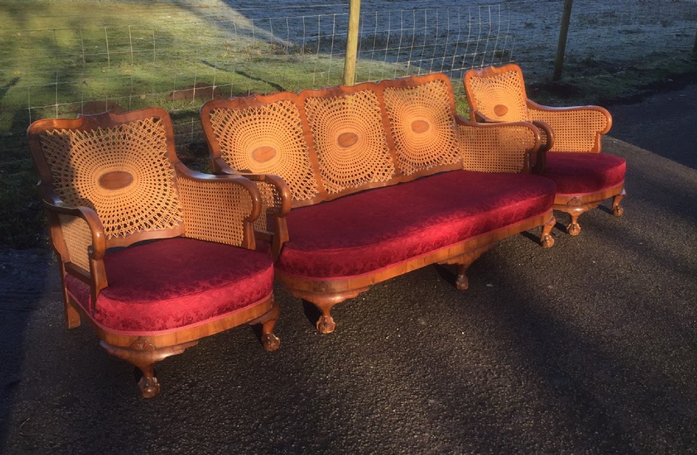 Walnut bergere three piece suite with feather seat and back cushions 
