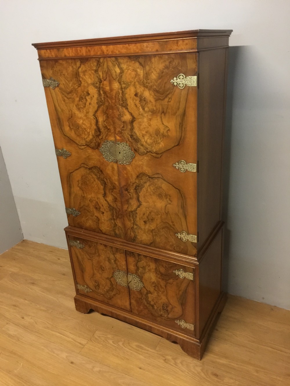 Burr walnut drinks cabinet with ornate brass fittings  View II
