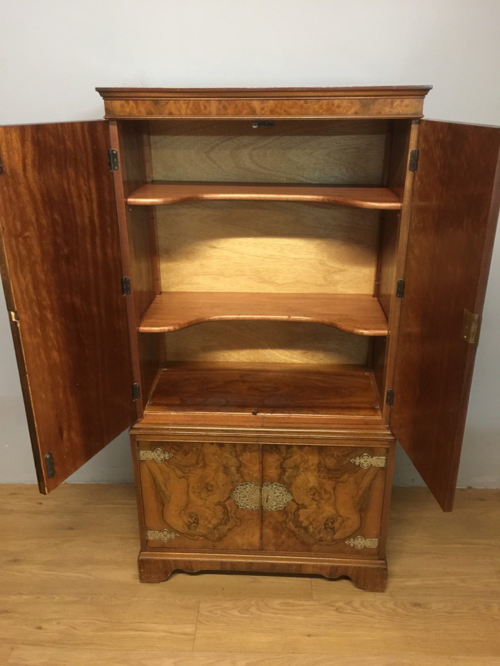 Burr walnut drinks cabinet with ornate brass fittings  View V