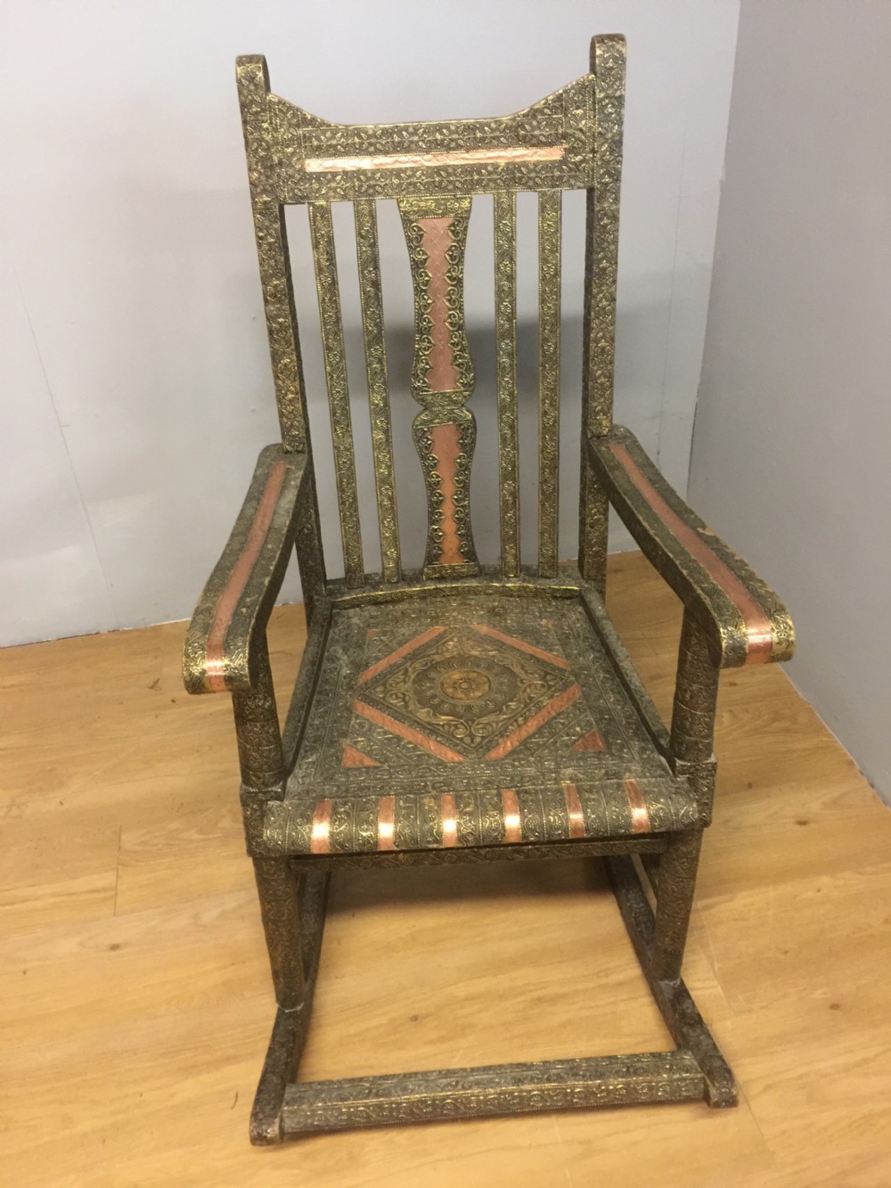 Anglo Indian brass and copper decorated rocking chair View II