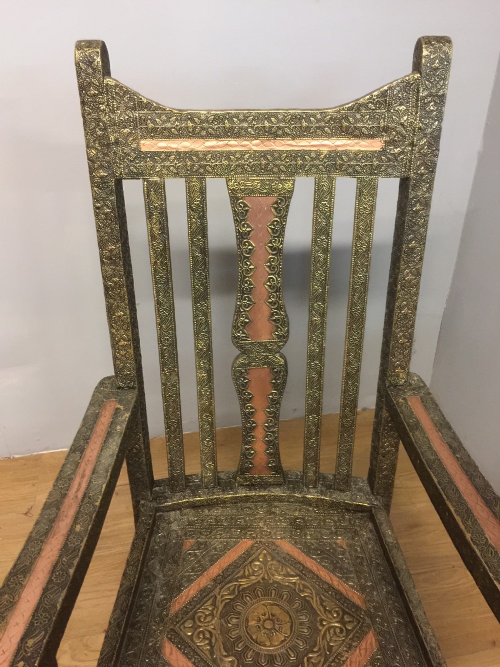 Anglo Indian brass and copper decorated rocking chair View IV