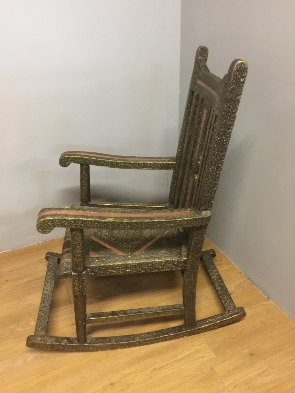 Anglo Indian brass and copper decorated rocking chair View X