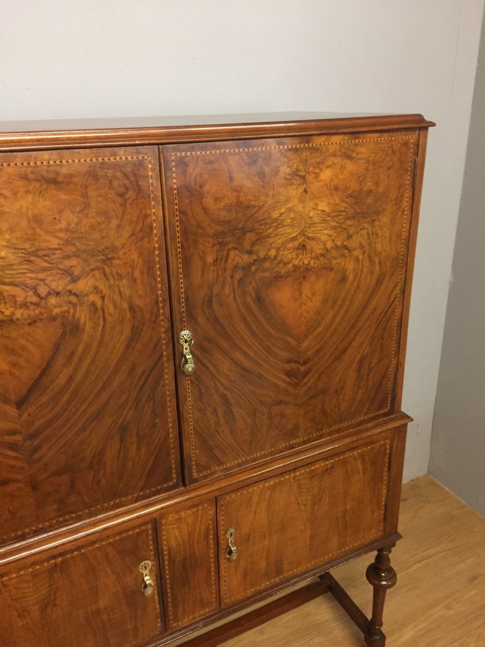 Inlaid burr walnut side cabinet on turned supports circa 1920 View IV