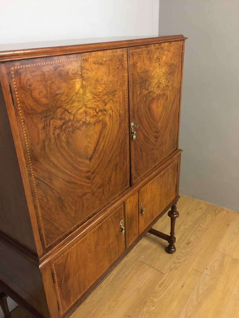 Inlaid burr walnut side cabinet on turned supports circa 1920 View V