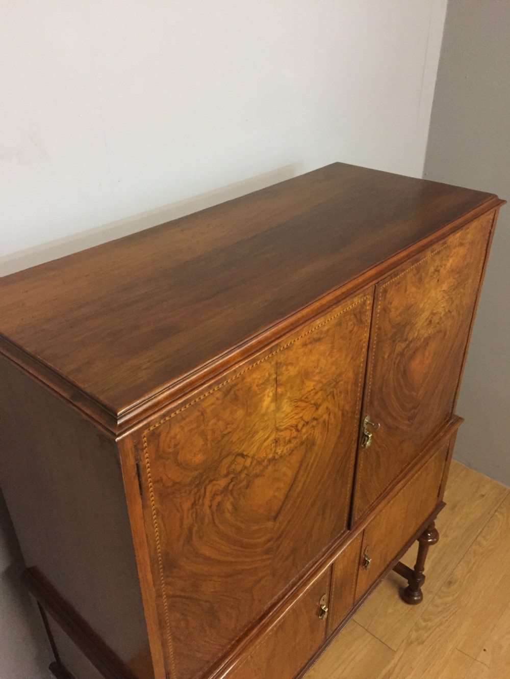 Inlaid burr walnut side cabinet on turned supports circa 1920 View VI