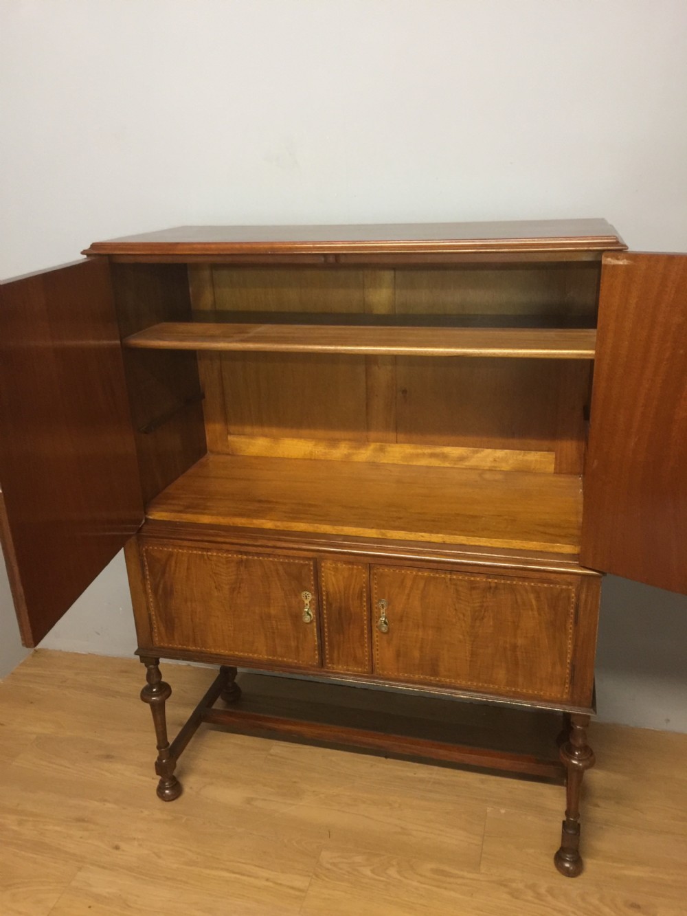 Inlaid burr walnut side cabinet on turned supports circa 1920 View VIII