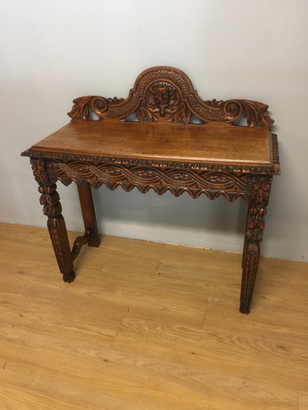 Nineteenth century carved solid oak console table with green man mask