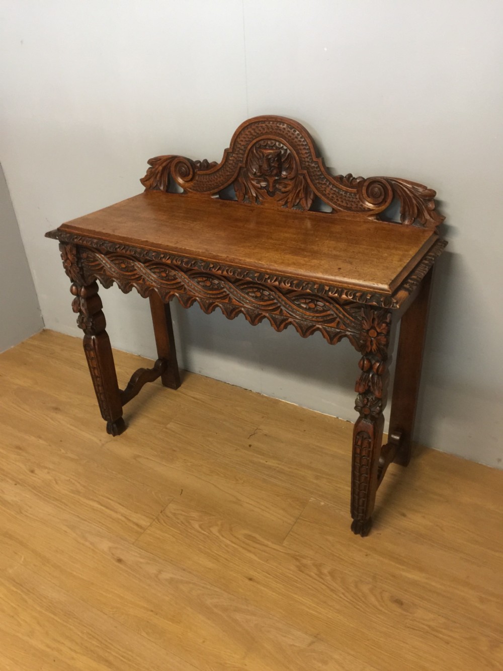 Nineteenth century carved solid oak console table with green man mask View II
