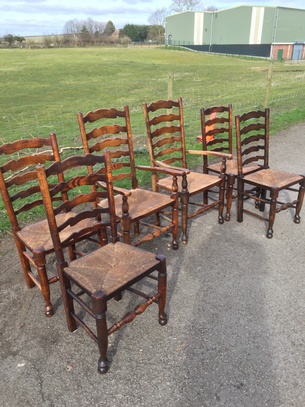 Set of six ladder back rush seated country chairs 