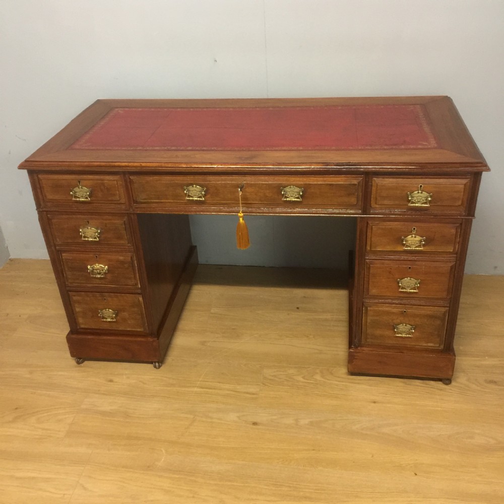 Nineteenth century walnut desk with tooled red leather top