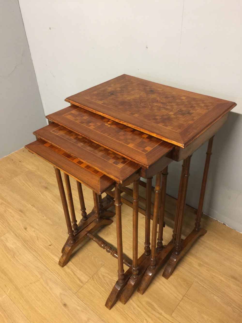 Edwardian quartetto of walnut tables with marquetry and parquetry tops View II