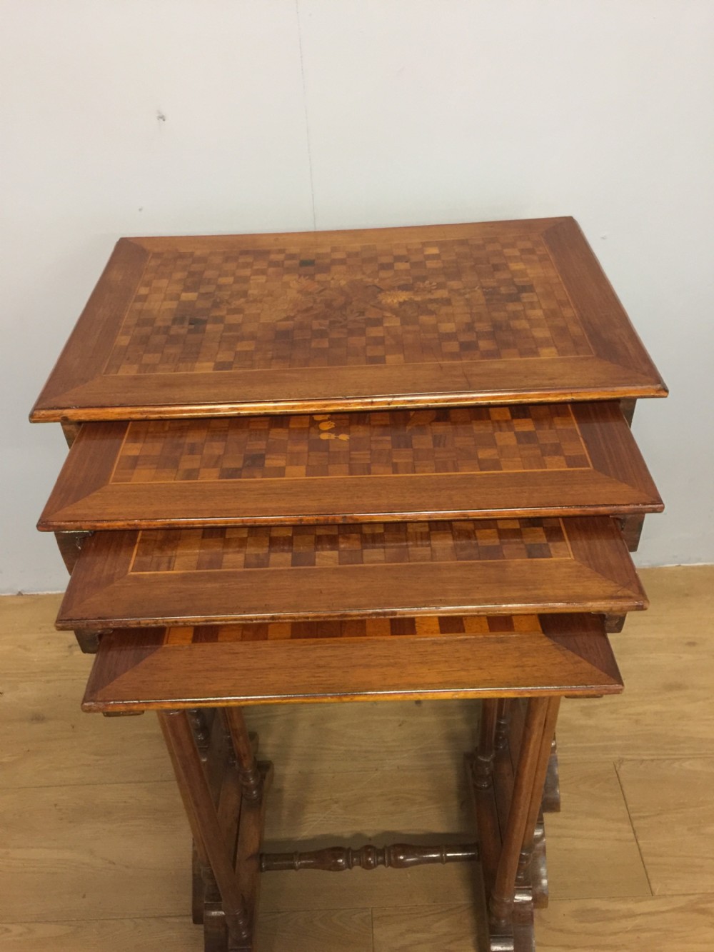 Edwardian quartetto of walnut tables with marquetry and parquetry tops View III