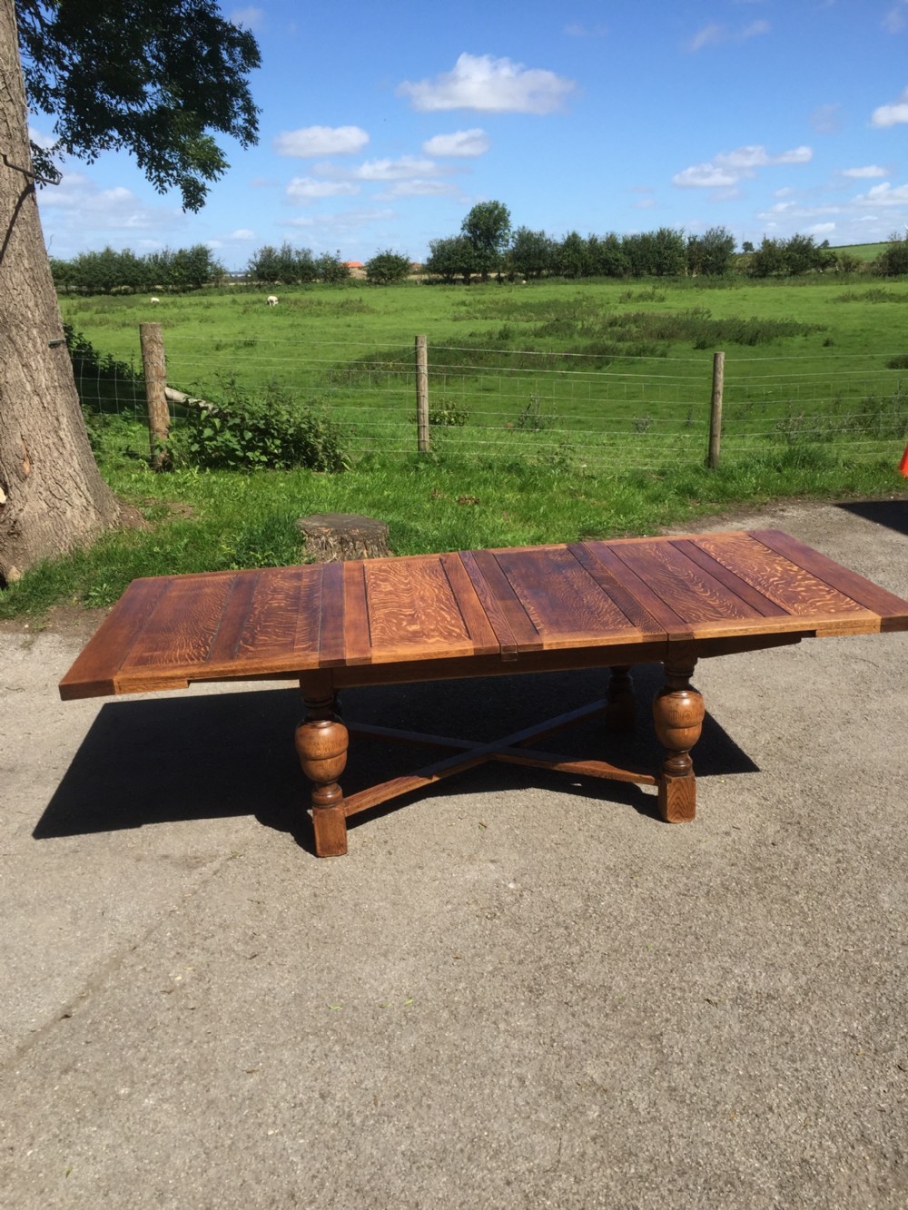 14 seater oak extending dining table on turned baluster legs  View XIV