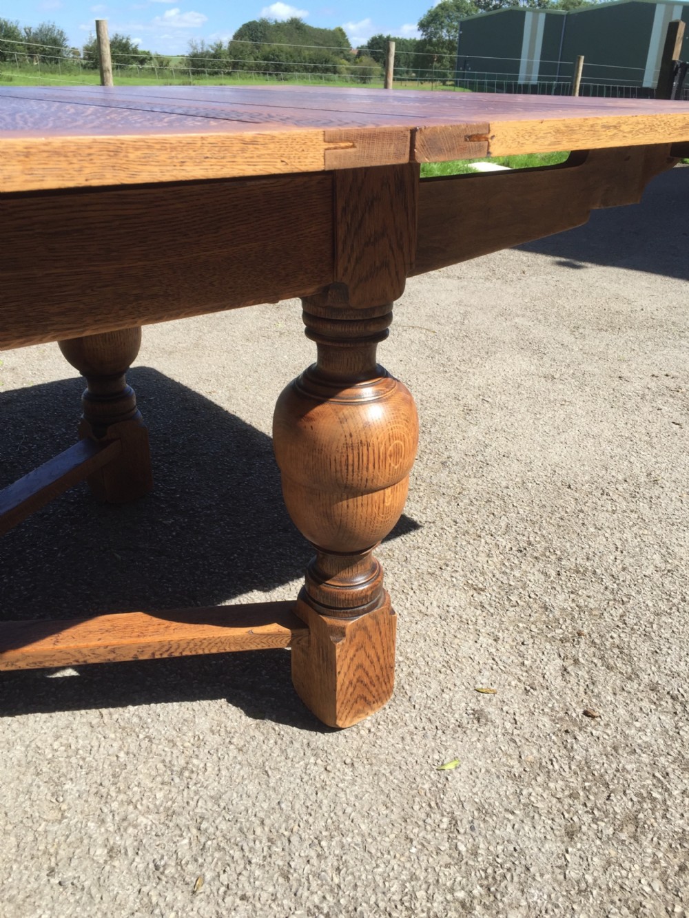 14 seater oak extending dining table on turned baluster legs  View XV