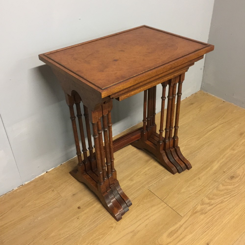 Quartetto of walnut tables on turned supports 