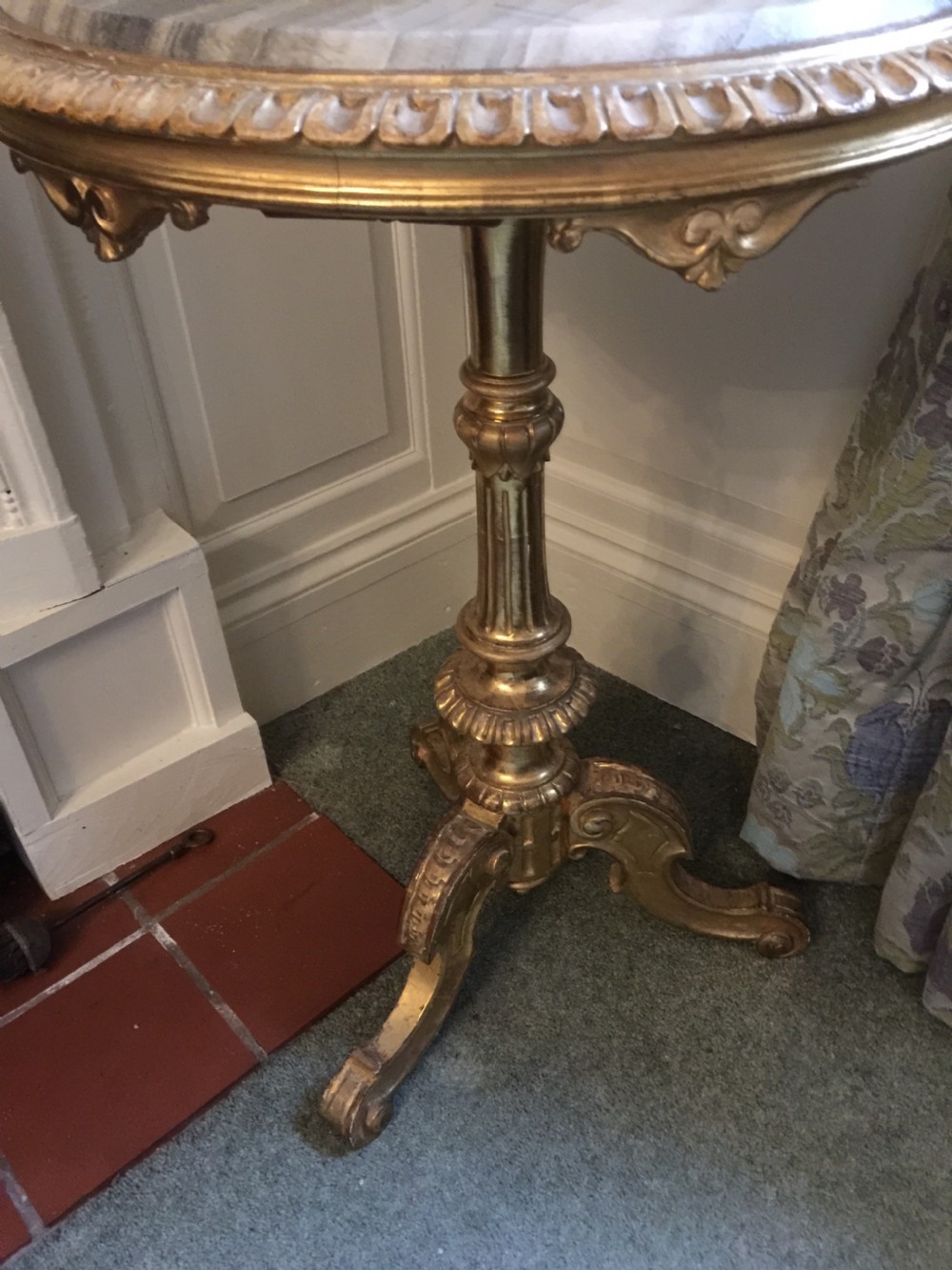 A 19th-century tripod table featuring a carved giltwood pedestal base, egg-and-dart moulding, and a circular variegated grey marble tabletop. View IV